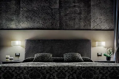 Letto o letti in una camera di Locanda Fiorita