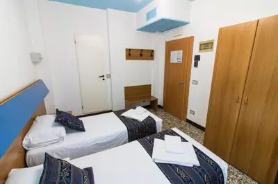 Letto o letti in una camera di BlueColors Hotel