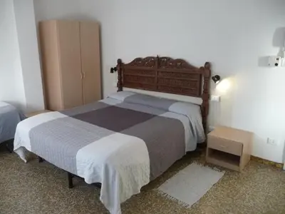 Letto o letti in una camera di Appartamento Franca