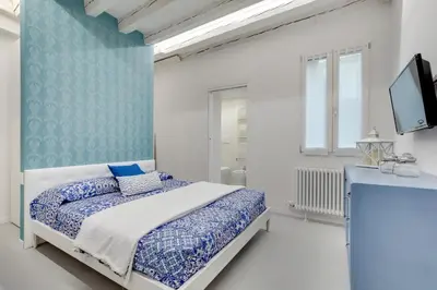 Letto o letti in una camera di Bacchus Venice Residence by Wonderful Italy