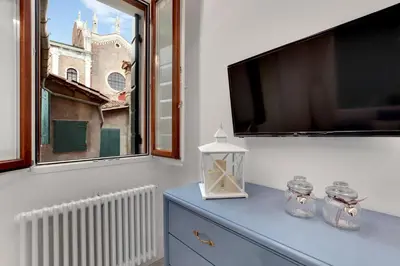 TV o dispositivi per l'intrattenimento presso Bacchus Venice Residence by Wonderful Italy