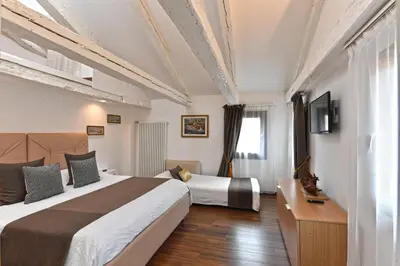 Letto o letti in una camera di Sweet Apartment Frari