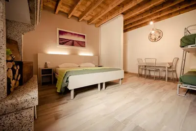 Letto o letti in una camera di Casa Bassetto