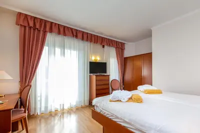 Letto o letti in una camera di Hotel Terme Leonardo