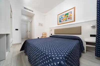 Letto o letti in una camera di Hotel Giotto