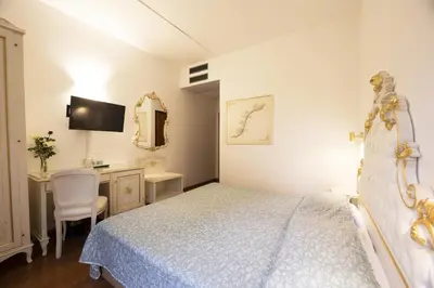 Letto o letti in una camera di Hotel Vienna
