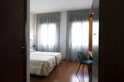 Letto o letti in una camera di Hotel Vienna