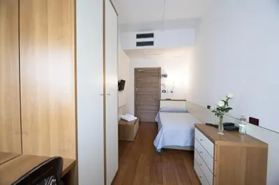 Letto o letti in una camera di Hotel Vienna