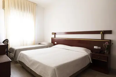Letto o letti in una camera di Hotel Vienna