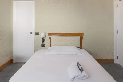 Letto o letti in una camera di B&B Hotel Chioggia Airone