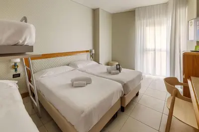 Letto o letti in una camera di B&B Hotel Chioggia Airone