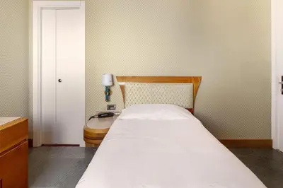 Letto o letti in una camera di B&B Hotel Chioggia Airone