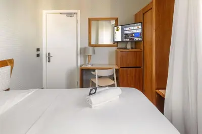 Letto o letti in una camera di B&B Hotel Chioggia Airone
