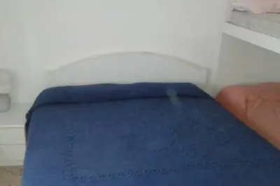 Letto o letti in una camera di Appartamento Centromare solo famiglie