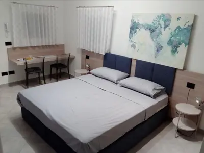 Letto o letti in una camera di Salvia e Timo Rooms