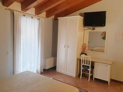 Letto o letti in una camera di Villa Serena Agriturismo