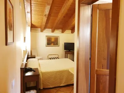 Letto o letti in una camera di Villa Serena Agriturismo