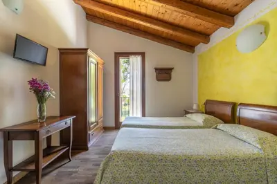 Letto o letti in una camera di Agriturismo Porcaloca