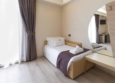 Letto o letti in una camera di Hotel Alla Corte SPA & Wellness Relax