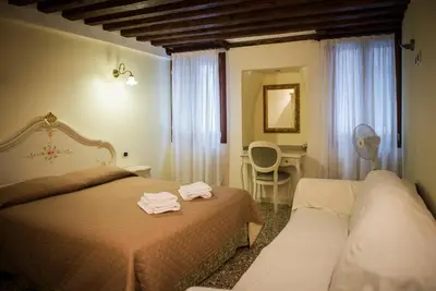 Letto o letti in una camera di Ca' Venere Apartments Cannaregio