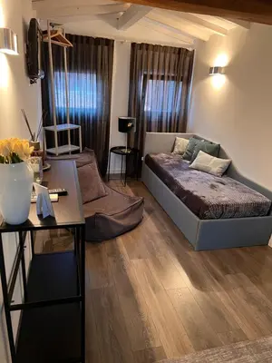 Letto o letti in una camera di La Loggia della Luna