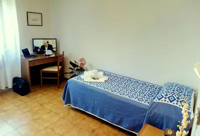 Letto o letti in una camera di Centro Vacanze Opera Nascimbeni