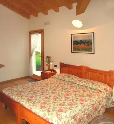 Letto o letti in una camera di Col Delle Rane