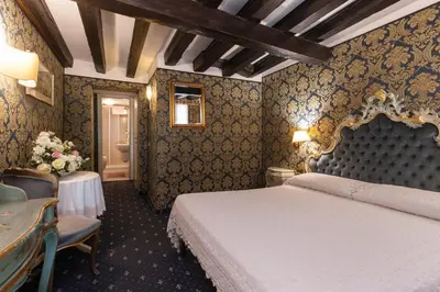 Letto o letti in una camera di Ca' Della Loggia