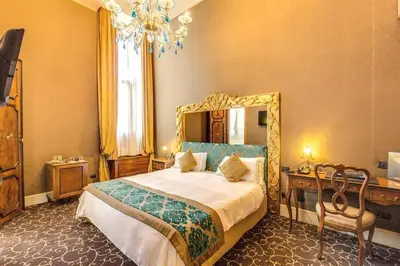 Letto o letti in una camera di Pesaro Palace