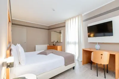 Letto o letti in una camera di Park Hotel Ai Pini & Restaurant Ai Pini