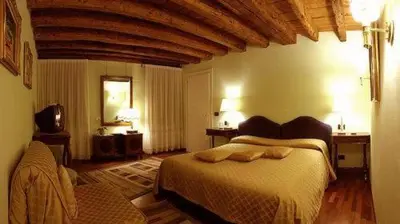 Letto o letti in una camera di Cà Satriano