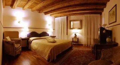 Letto o letti in una camera di Cà Satriano