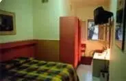 Letto o letti in una camera di Hotel Tre Santi
