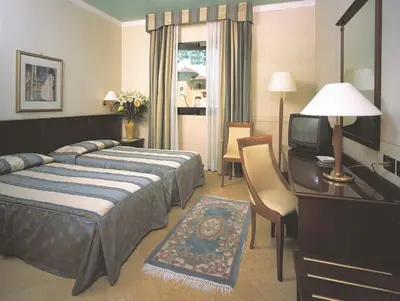 Letto o letti in una camera di Hotel Lugano Torretta
