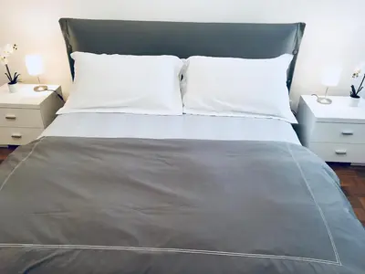 Letto o letti in una camera di Central Apartment