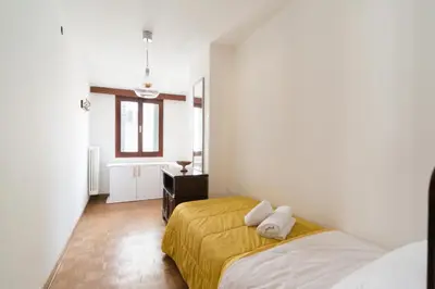 Letto o letti in una camera di Ca' alla Colombina by Sarlux