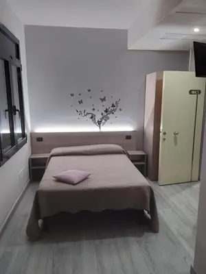 Letto o letti in una camera di Hotel Alle Scuole NEW