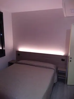 Letto o letti in una camera di Hotel Alle Scuole NEW