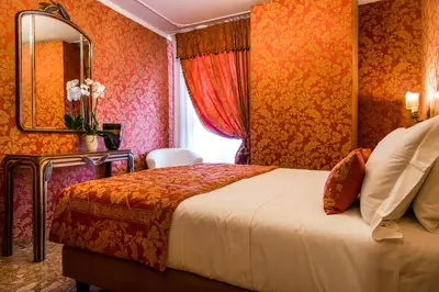 Letto o letti in una camera di Hotel Santo Stefano