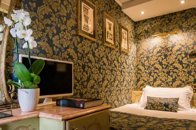 Letto o letti in una camera di Hotel Santo Stefano