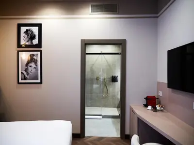Letto o letti in una camera di The Glam Boutique Hotel & Apt