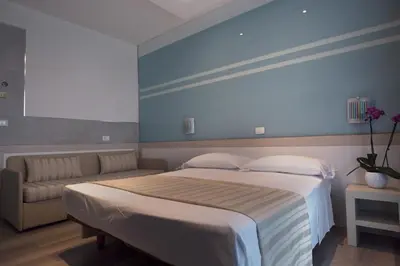 Letto o letti in una camera di Hotel Colombo