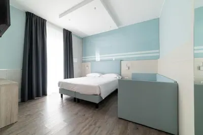 Letto o letti in una camera di Hotel Colombo