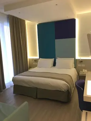 Letto o letti in una camera di Hotel Colombo