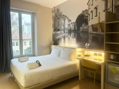 Letto o letti in una camera di B&B Hotel Treviso