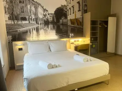 Letto o letti in una camera di B&B Hotel Treviso