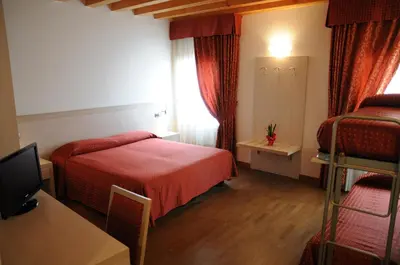 Letto o letti in una camera di Hotel 5 Colonne