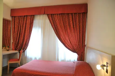Letto o letti in una camera di Hotel 5 Colonne