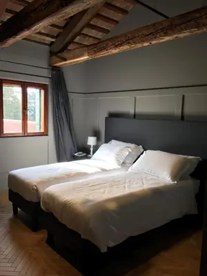 Letto o letti in una camera di Hotel 5 Colonne
