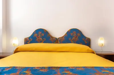 Letto o letti in una camera di Hotel Casa Boccassini